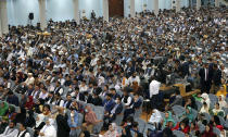 Delegates, attend the last day of an Afghan Loya Jirga or traditional council, in Kabul, Afghanistan, Sunday, Aug. 9, 2020. The council concluded Sunday with hundreds of delegates agreeing to free 400 Taliban members, paving the way for an early start to negotiations between Afghanistan's warring sides. (AP Photo)