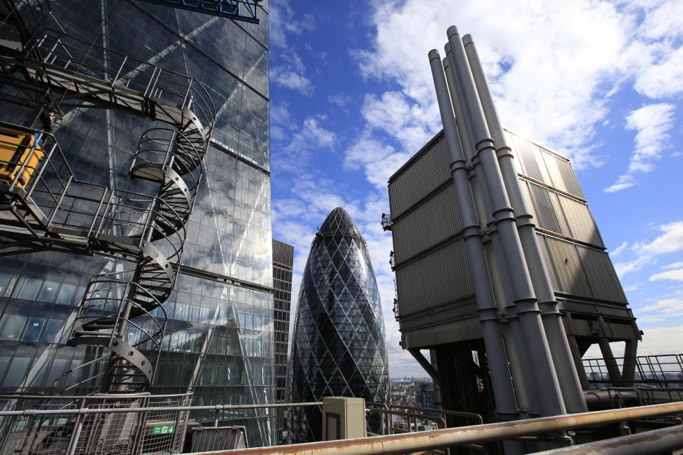 30 St. Mary Axe or 'The Gherkin' viewed from the roof of the Lloyds of London building, Lime Street, London.