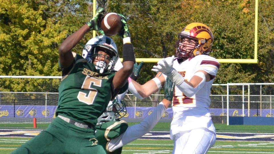 Kenai Simmons of Schalick (5) steps in front of Gloucester Catholic's Kyle Gulden to intercept a pass during their West Jersey Football League Horizon Division game Saturday, October 22, 2022 at Gloucester City High School.