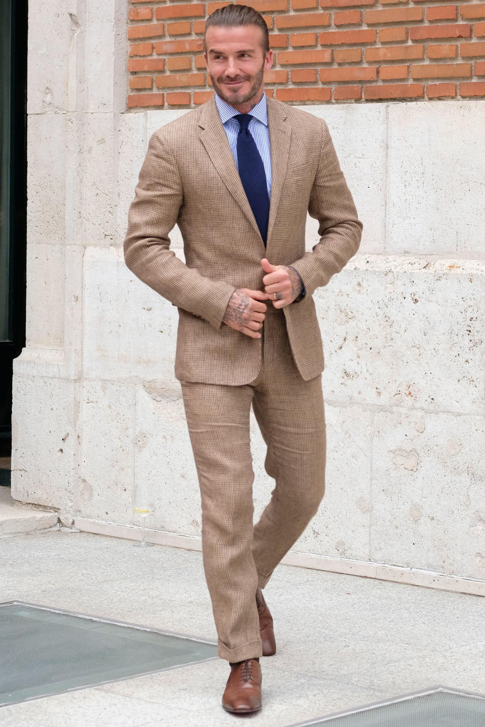 <p><strong>20 June</strong> David Beckham stepped out in Madrid wearing a heritage brown Ralph Lauren suit with a pin-striped blue shirt and tie. </p>