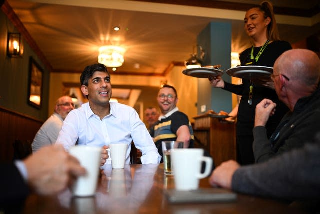 Rishi Sunak meeting veterans at a community breakfast 