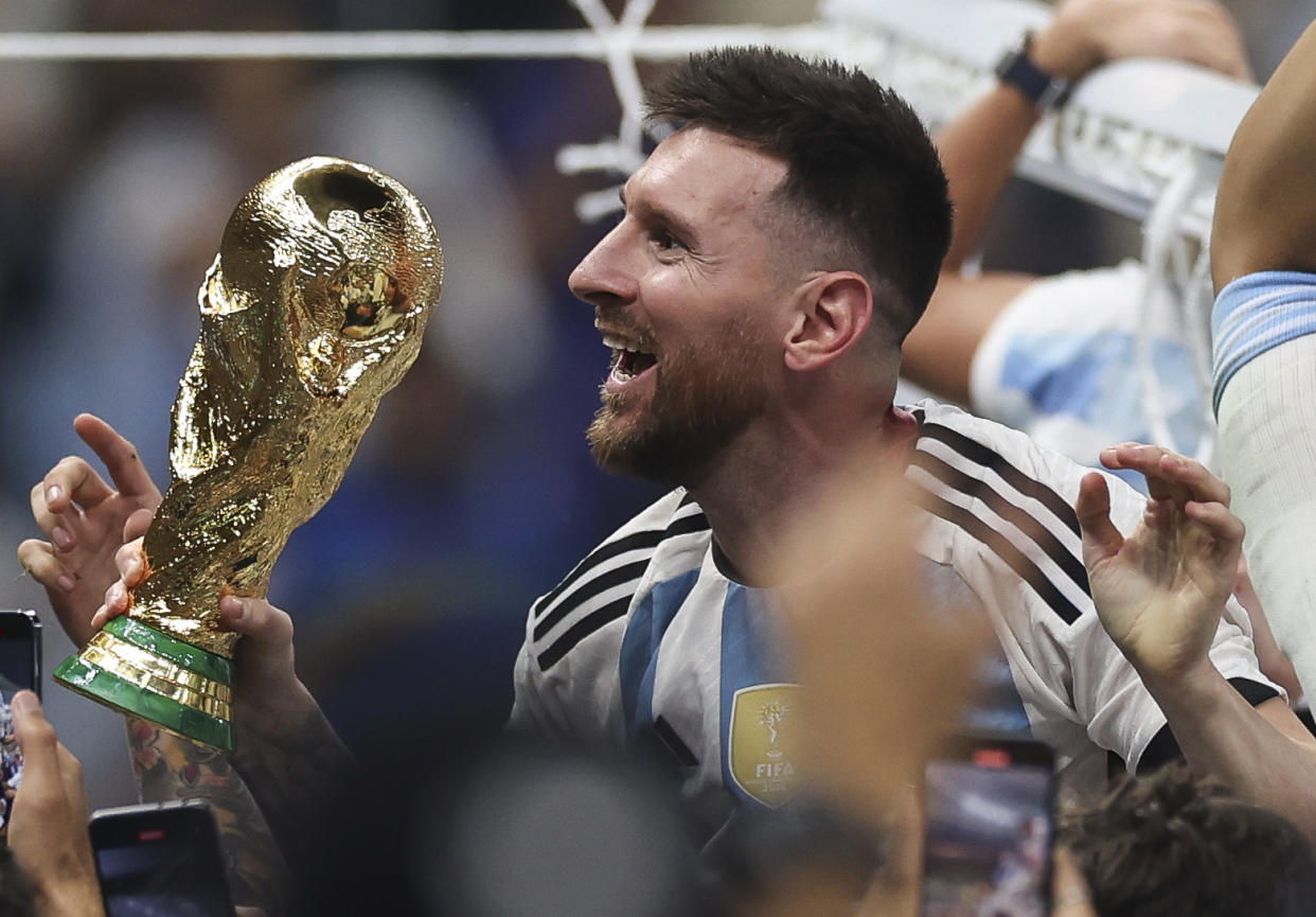 LUSAIL CITY, QATAR - DECEMBER 18: Lionel Messi of Argentina celebrates at full time after winning the World Cup Qatar 2022  during the FIFA World Cup Qatar 2022 Final match between Argentina and France at Lusail Stadium on December 18, 2022 in Lusail City, Qatar. (Photo by Ian MacNicol/Getty Images)