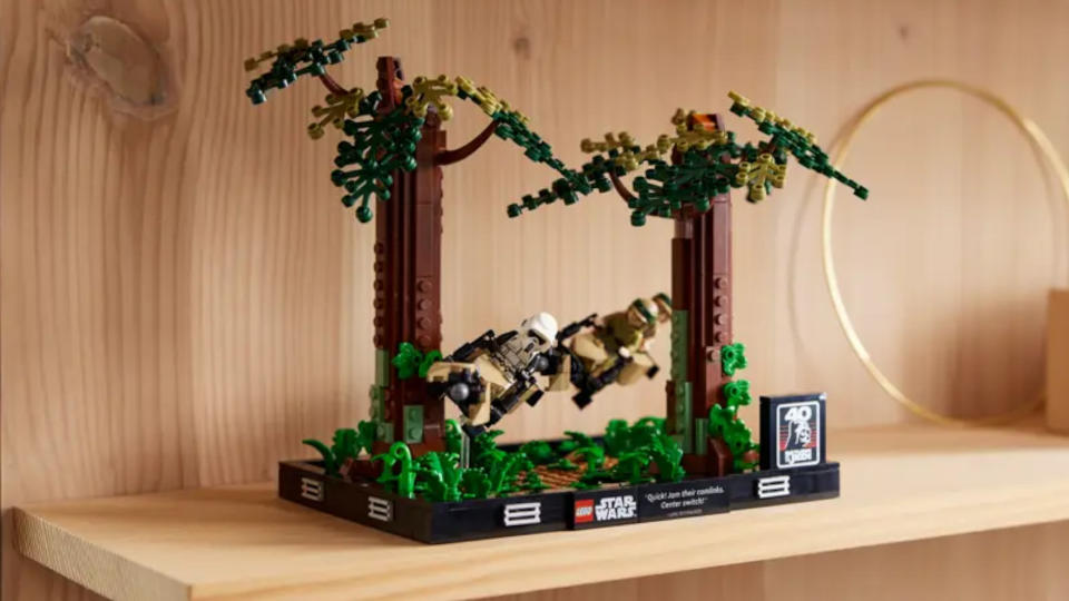 The Lego Endor Speeder Chase Diorama on a wooden shelf