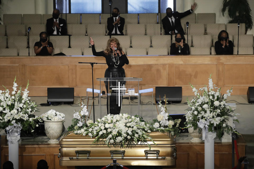 A performer sings near Robert Fuller's casket during his funeral Tuesday, June 30, 2020, in Littlerock, Calif. Fuller, a 24-year-old Black man, was found hanging from a tree in a park in a Southern California high desert city. Authorities initially said the death of Fuller appeared to be a suicide but protests led to further investigation, which continues. (AP Photo/Marcio Jose Sanchez)