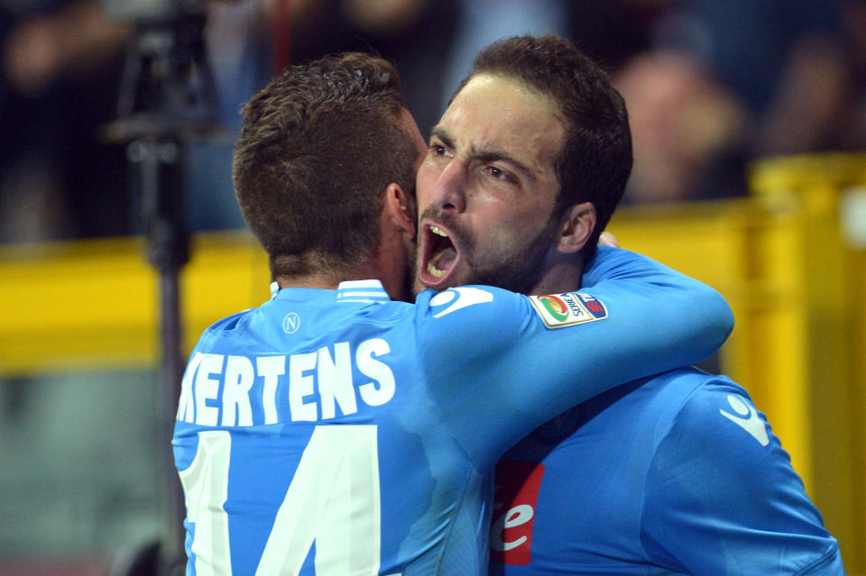 Napoli forward Gonzalo Higuain, right, celebrates with his teammate Dries Mertens after scoring during a Serie A soccer match between Napoli and Torino, at the Olympic stadium, in Turin, Italy, Monday, March 17, 2014. (AP Photo/Massimo Pinca)