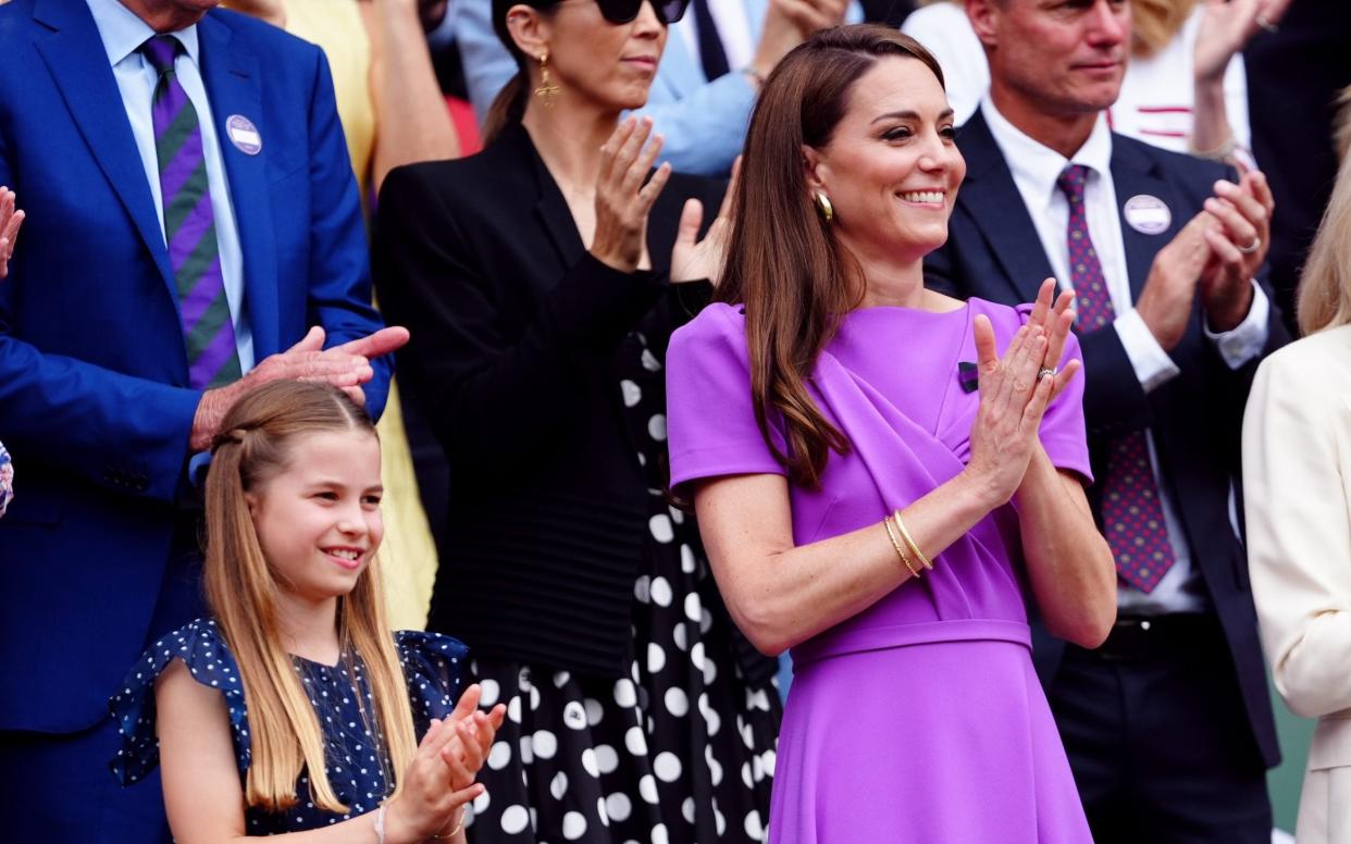 The Princess of Wales and and Princess Charlotte applaud from the royal box