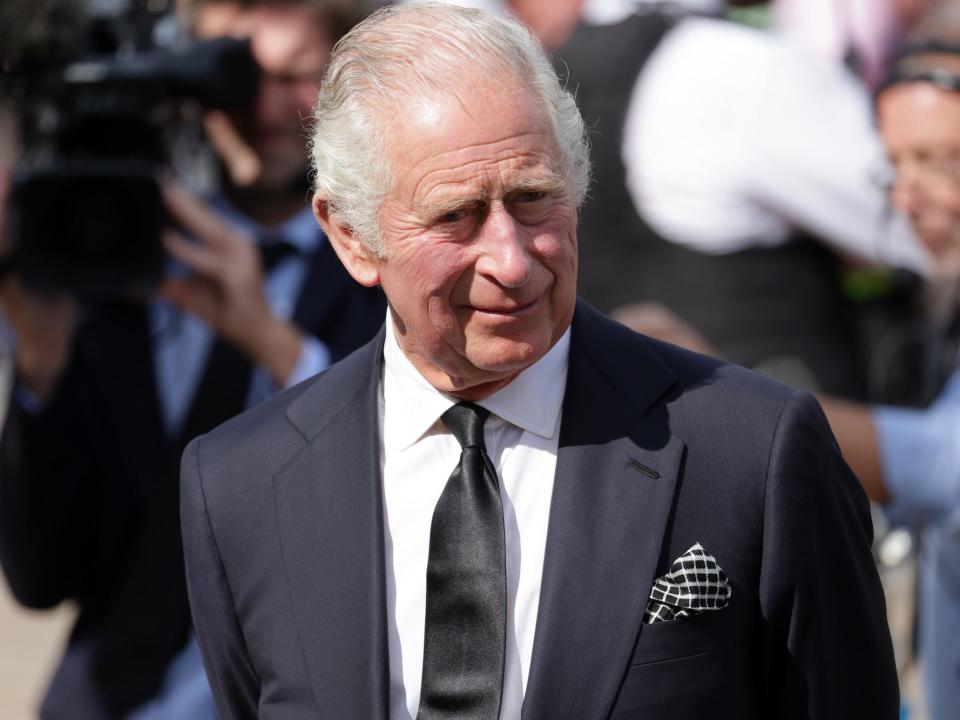 King Charles III in front of Buckingham Palace the day after Queen Elizabeth's death.