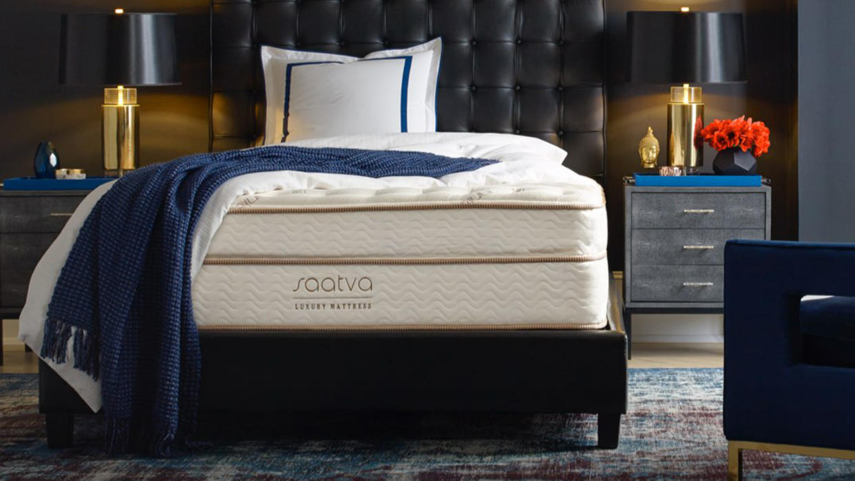  Where to buy a Saatva mattress: image shows the Saatva Classic Luxury Firm on a black bed frame with a blue throw draped across it. 