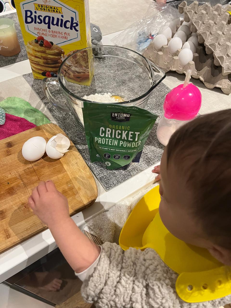 The author cooking with her baby