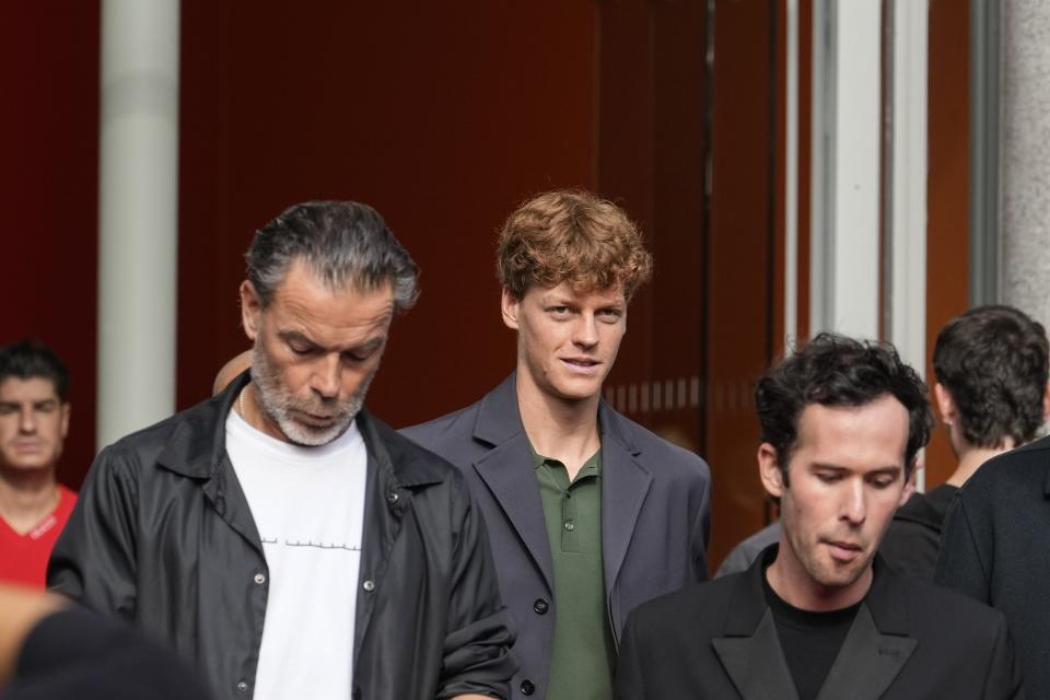 Jannik Sinner, centre, departs the Gucci Spring Summer 2025 collection, that was presented in Milan, Italy, Friday, Sept. 20, 2024. (AP Photo/Luca Bruno).