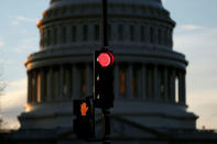 A traffic light shines red after President Donald Trump and the U.S. Congress failed to reach a deal on funding for federal agencies in Washington, U.S., January 20, 2018. REUTERS/Joshua Roberts