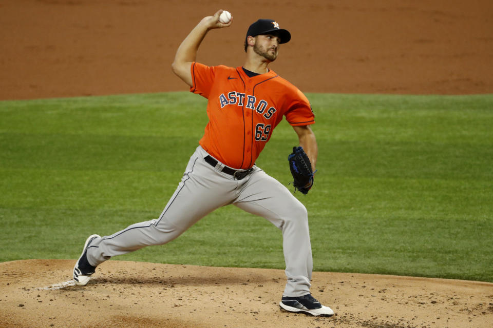 Houston Astros starting pitcher Chase De Jong works against the Texas Rangers during the first inning of a baseball game in Arlington, Texas, Sunday, Sept. 27, 2020. (AP Photo/Roger Steinman)