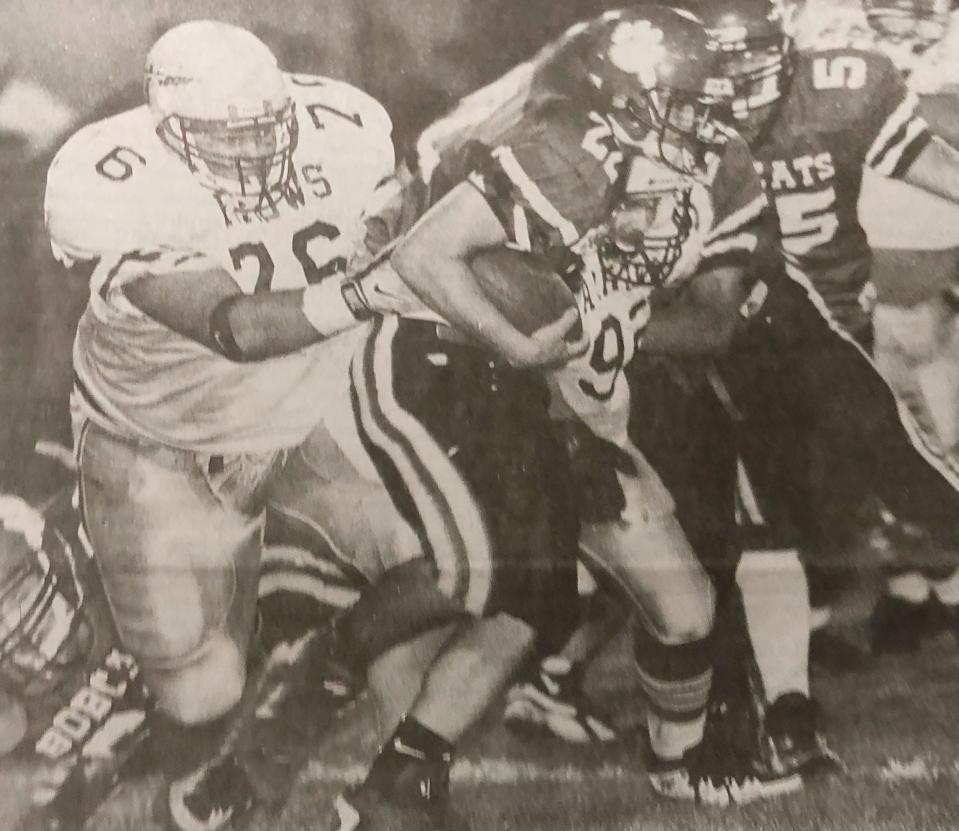 Watertown's Nathan Lamb (left) holds onto Brookings' Andy Nayhart during their Eastern South Dakota Conference football game in 1997.