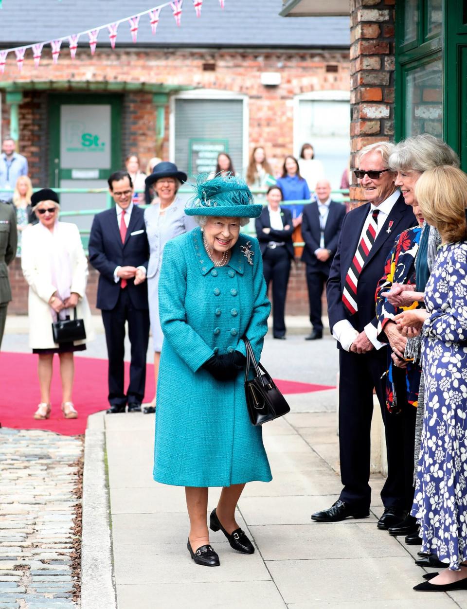 Queen Elizabeth II visits the set of the long running television series Coronation Street, on July 8, 2021 in Manchester, England