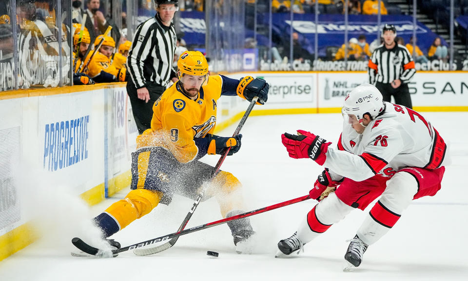 NASHVILLE, TN - MAY 10: Filip Forsberg #9 of the Nashville Predators skates against Vincent Trocheck #16 of the Carolina Hurricanes during the second period at Bridgestone Arena on May 10, 2021 in Nashville, Tennessee. (Photo by John Russell/NHLI via Getty Images)