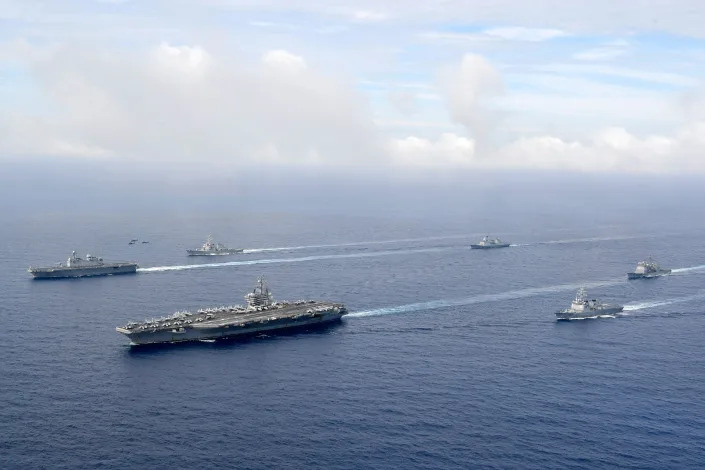  In this handout image released by the South Korean Defense Ministry, Aircraft Carrier USS Ronald Reagan and South Korea's Marado amphibious landing ship take part in a joint naval exercise on June 04, 2022 at an undisclosed location