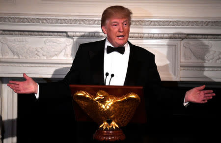 President Donald Trump gestures as he addresses the nation's governors, in town for their Annual Winter Meetings, as he hosts the Governor's Ball at the White House, Washington, DC, U.S., February 25, 2018. REUTERS/Mike Theiler