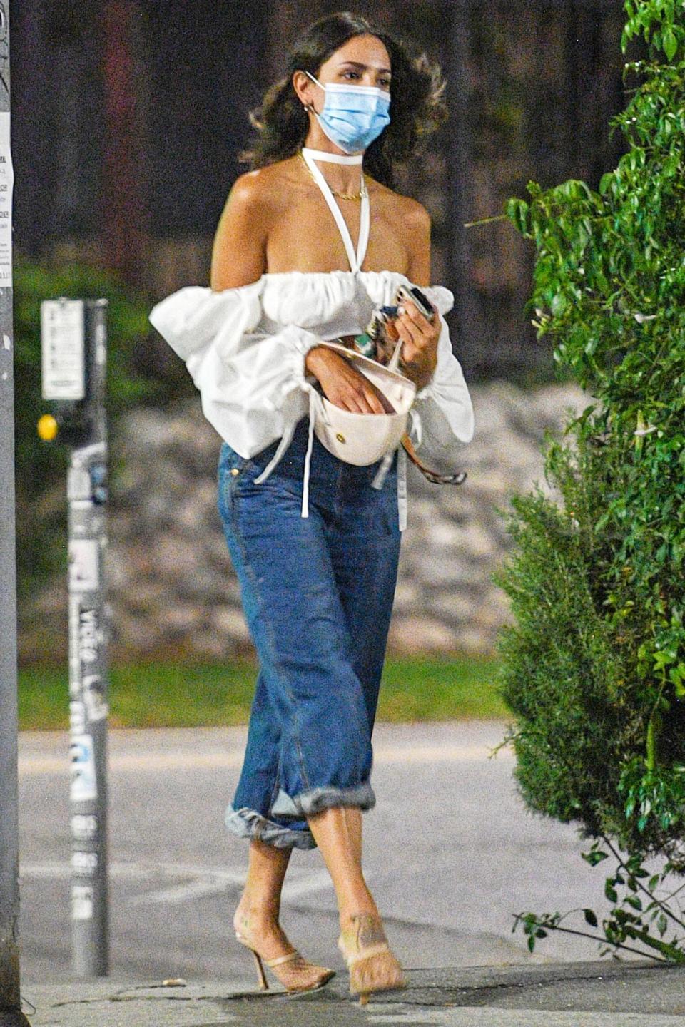 <p>Eiza Gonzales looks chic as she’s seen leaving pal Taika Waititi’s birthday party in a white blouse and cuffed blue jeans on Friday in Malibu. </p>