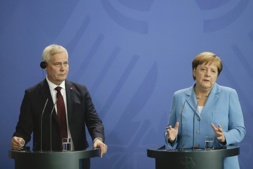 German Chancellor Angela Merkel, right, and the Prime Minister of Finland Antti Rinne brief the media after a meeting at the chancellery in Berlin, Wednesday, July 10, 2019. (AP Photo/Markus Schreiber)