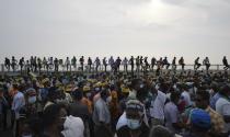 FILE- Supporters of Sri Lanka's main opposition gather for a protest as the country suffers one of the worst economic crises in history, outside the president's office in Colombo, Sri Lanka, Tuesday, March 15, 2022. (AP Photo/Eranga Jayawardena, File)