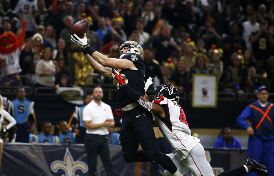New Orleans Saints tight end Dan Arnold (85) pulls in a touchdown reception over Atlanta Falcons defensive back Sharrod Neasman in the second half of an NFL football game in New Orleans, Thursday, Nov. 22, 2018. (AP Photo/Butch Dill)