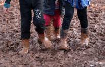 Children walk in mud in Azaz