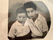 In this photo provided by Ruth Brandspiegel, brothers and Holocaust survivors Moty Eisenberg, left, and Israel "Sasha" Eisenberg are photographed at the Hallein Displaced Persons Camp in Austria in 1949. Brandspiegel recently became reunited, after more than 70 years, with fellow Holocaust survivor Israel "Sasha" Eisenberg, whom she met at the displaced camp in Austria where they became friends. (Courtesy of Ruth Brandspiegel via AP)