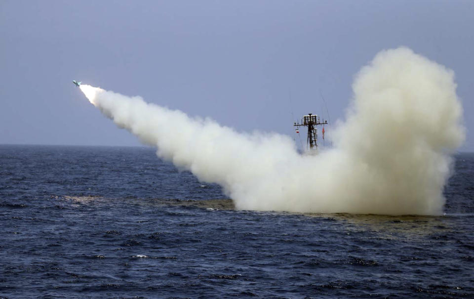 In this photo provided Thursday, June 18, 2020, by the Iranian Army, a warship launches a missile during a naval exercise. State media reported Thursday that Iran test fired cruise missiles in a naval exercise in the Gulf of Oman and northern Indian Ocean. The report by the official IRNA news agency said the missiles destroyed targets at a distance of 280 kilometers (170 miles). (Iranian Army via AP)