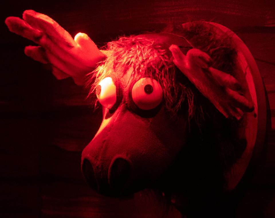 A puppet on the wall speaks during “Evil Dead The Musical” on Thursday, Oct. 27, 2022, at Theatreworks On The Square in Memphis.