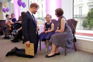 Harry meets Erin Cross, 7, the winner of the Inspirational Child Award ages 4-6.