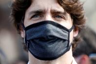 Canada's Prime Minister Justin Trudeau wears a mask as he takes part in a rally against the death in Minneapolis police custody of George Floyd, on Parliament Hill, in Ottawa