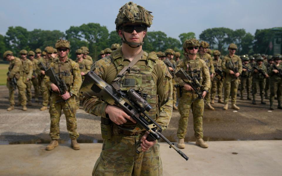 Australian troops parade - Aaron Favila/AP