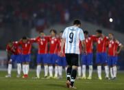 Argentina's Gonzalo Higuain walks back after failing to score on a penalty kick against Chile in their Copa America 2015 final soccer match at the National Stadium in Santiago, Chile, July 4, 2015. REUTERS/Marcos Brindicci