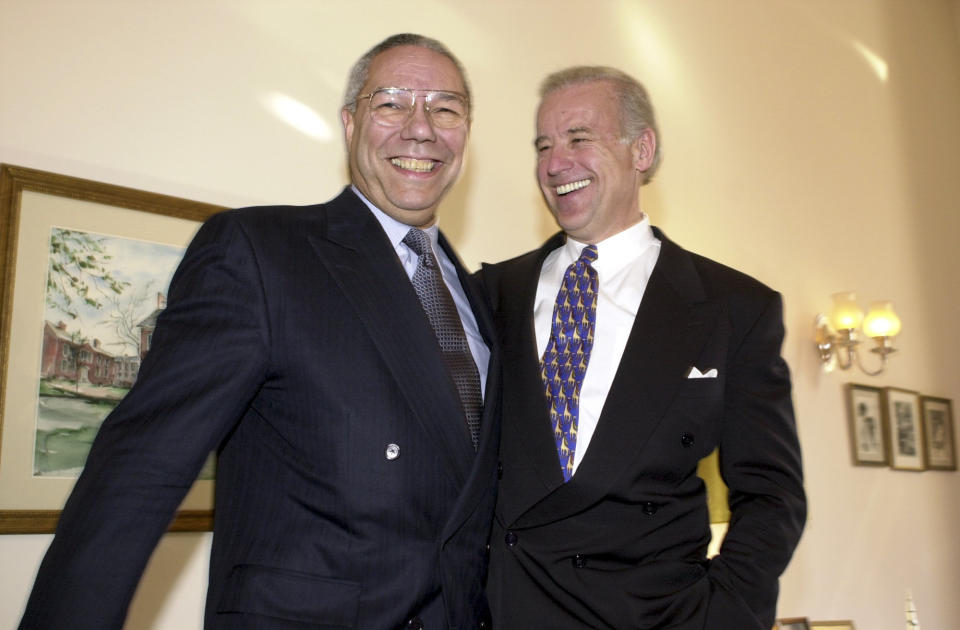 Gen. Colin Powell and Biden share a light moment during a photo op before a&nbsp;question-and-answer session with the press on Jan. 9, 2001.