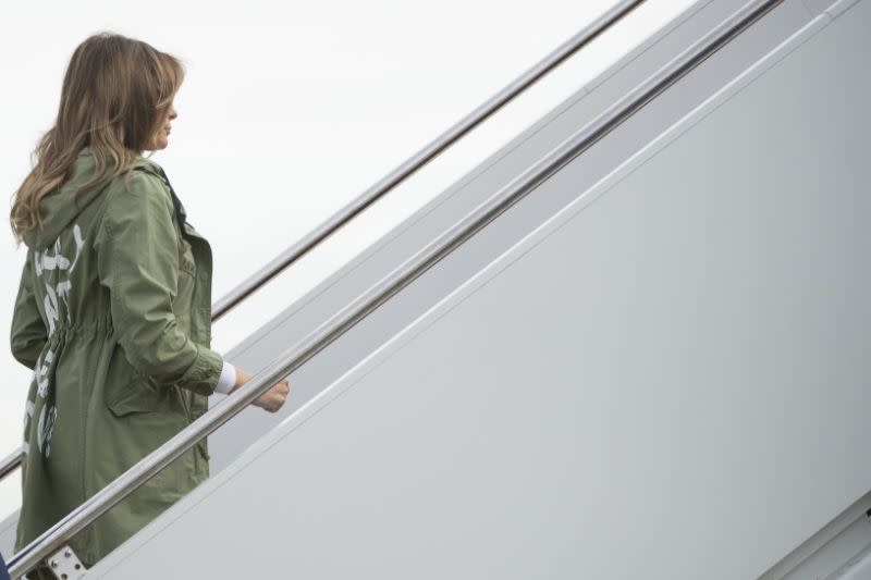 She wore the coat as she visited a facility housing migrant children separated from their parents. Source: AP