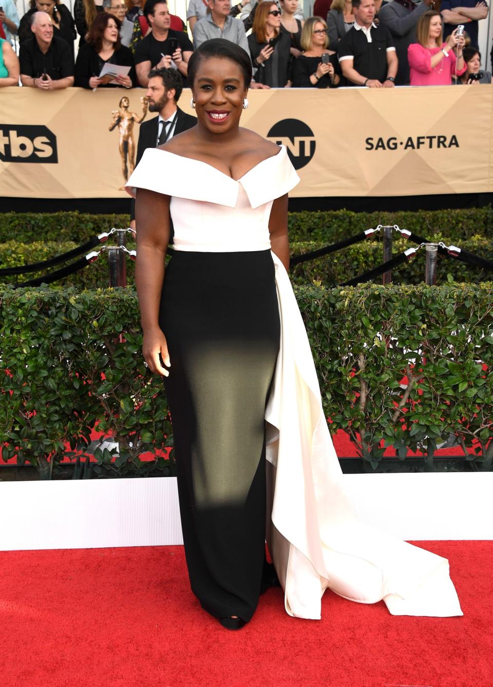 Uzo Aduba in a black and white gown with a long train