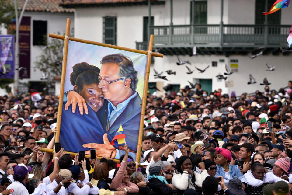 Supporters of President Gustavo Petro of Colombia hold a painting depicting him and his Vice President, Francia Márquez, during the presidential inauguration at Plaza Bolivar on Aug. 7, 2022 in Bogotá, Colombia.<span class="copyright">Guillermo Legaria—Getty Images</span>