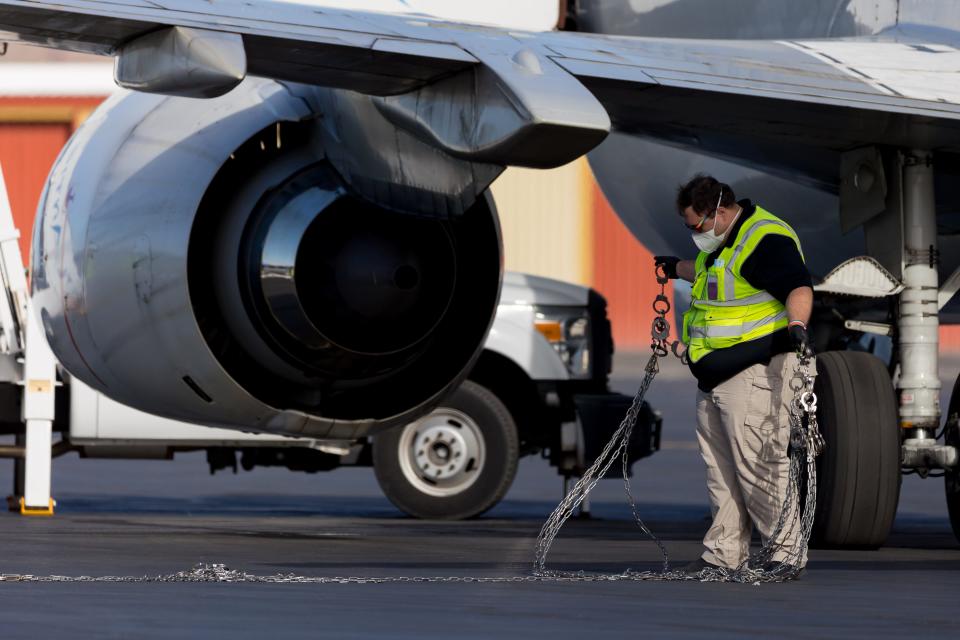 Shackles and handcuffs are extended for the next group of migrants to be boarded onto planes to be transferred out of the United States through commercial airlines and chartered flights supporting ICE field offices and the U.S. Department of Homeland Security on June 2.