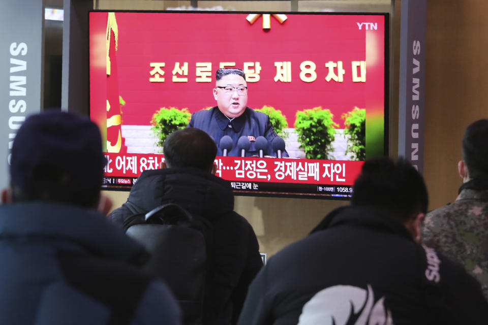 People watch a TV screen showing North Korean leader Kim Jong Un during a ruling party congress, at the Seoul Railway Station in Seoul, South Korea, Wednesday, Jan. 6, 2021. Kim opened his country's first ruling party congress in five years with an admission of policy failures and a vow to set new developmental goals, state media reported Wednesday. (AP Photo/Ahn Young-joon)