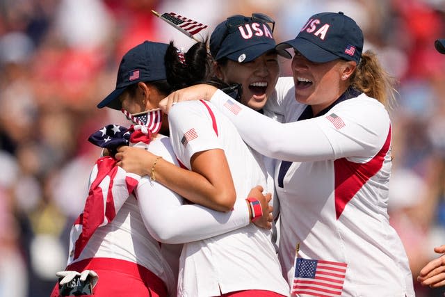 United States players celebrate after winning the Solheim Cup golf tournament at the Robert Trent Jones Golf Club, Sunday, Sept. 15, 2024, in Gainesville, Va. 