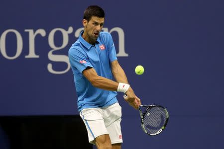 Sep 4, 2016; New York, NY, USA; Novak Djokovic of Serbia hits a backhand against Kyle Edmund of Great Britain (not pictured) on day seven of the 2016 U.S. Open tennis tournament at USTA Billie Jean King National Tennis Center. Mandatory Credit: Geoff Burke-USA TODAY Sports