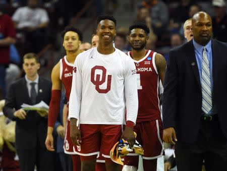 Mar 22, 2019; Columbia, SC, USA; Oklahoma Sooners forward Kristian Doolittle (21) celebrates with teammate during the second half against the Mississippi Rebels in the first round of the 2019 NCAA Tournament at Colonial Life Arena. Mandatory Credit: Bob Donnan-USA TODAY Sports