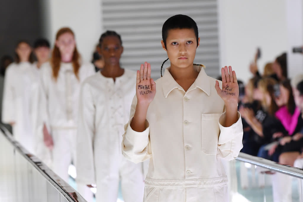 A model has staged an unplanned mental health protest on the Gucci catwalk at Milan Fashion week [Photo: Getty]