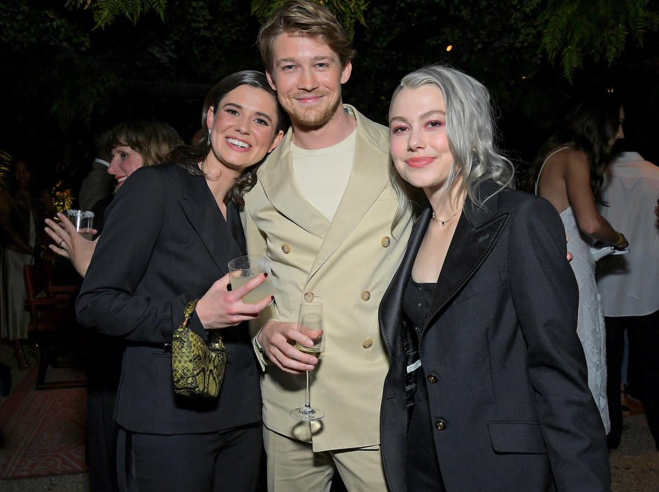<p>LOS ANGELES, CALIFORNIA - MAY 18: (L-R) Alison Oliver and Joe Alwyn of <em>Conversations with Friends </em>pose with Phoebe Bridgers at the Elle Hollywood Rising event in L.A. on May 18. </p>