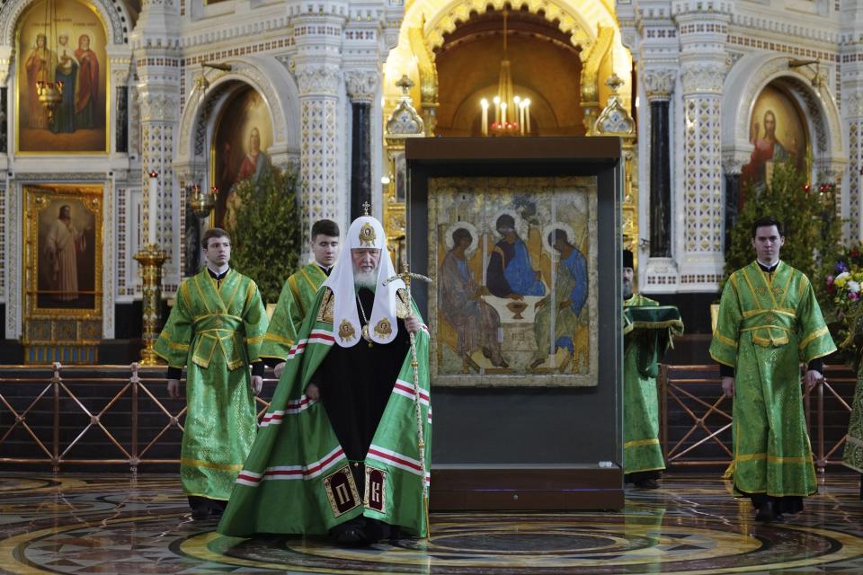 In this photo released by Russian Orthodox Church Press Service, Russian Orthodox Church Patriarch Kirill, foreground, conducts an Orthodox service celebrating Trinity Sunday, in the Christ the Savior Cathedral in Moscow, Russia, Sunday, June 4, 2023, with Russia's most famous icon, center, transferred from a museum to Moscow's main cathedral despite the keepers' vociferous protests The Trinity icon by Andrei Rublev that was kept in Moscow's Tretyakov Gallery since the 1920s was moved to Christ the Savior Cathedral for the holiday on President Vladimir Putin's order. Putin's sudden order to hand over the 15th century icon to the church came despite protests from the Tretyakov keepers that the icon was too fragile to move. (Oleg Varov/Russian Orthodox Church Press Service via AP)