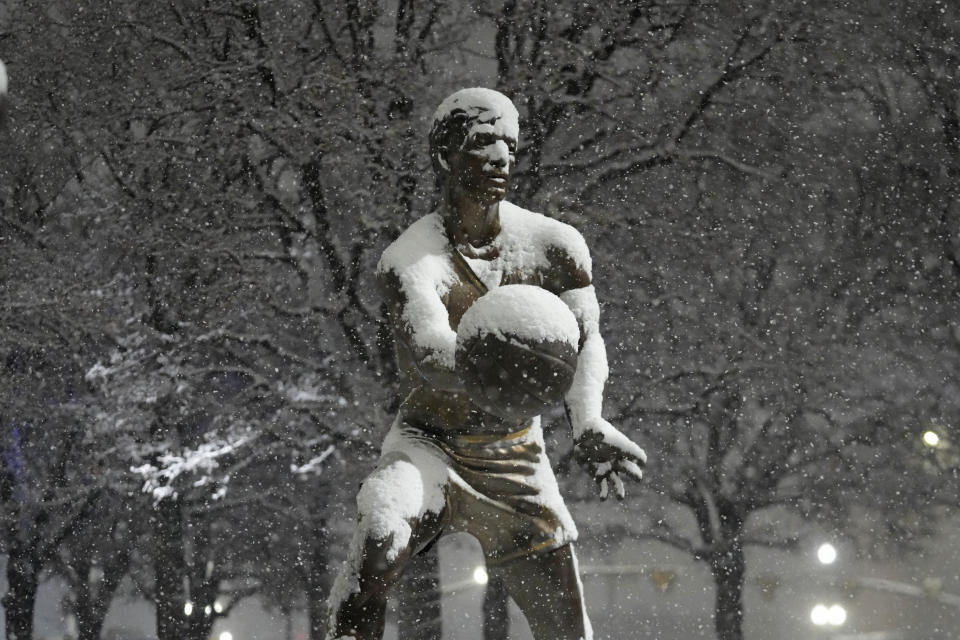 Former Utah Jazz player John Stockton's bronze statue is shown during a snow storm before an NBA basketball game against the Denver Nuggets Wednesday, Jan. 10, 2024, outside of the Delta Center, in Salt Lake City. (AP Photo/Rick Bowmer)