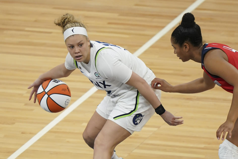 Minnesota Lynx guard Rachel Banham (15) dribbles in the second half of a WNBA basketball game against the Washington Mystics in Minneapolis, Saturday, May 8, 2021. (Renee Jones Schneider/Star Tribune via AP)