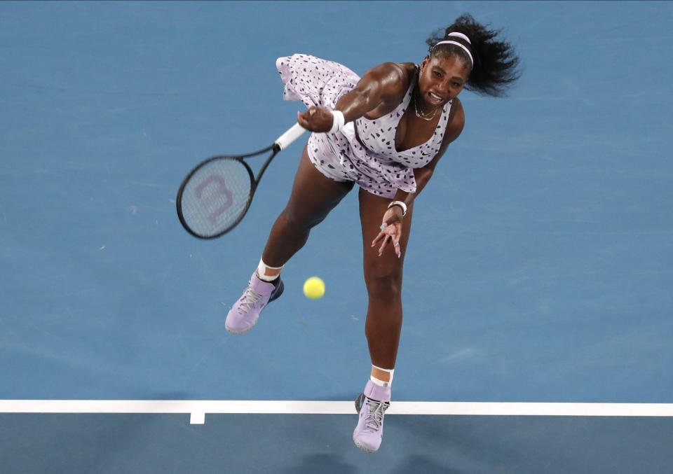 Serena Williams of the U.S. serves to Slovenia's Tamara Zidansek during their second round singles match at the Australian Open tennis championship in Melbourne, Australia, Wednesday, Jan. 22, 2020. (AP Photo/Lee Jin-man)