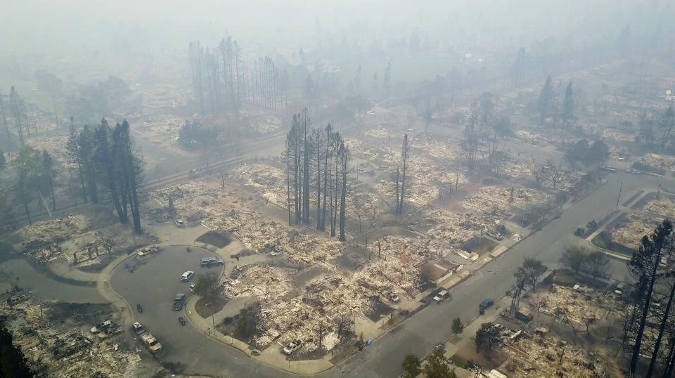 <p>This aerial image shows a neighborhood that was destroyed by a wildfire in Santa Rosa, Calif., Tuesday, Oct. 10, 2017. (Photo: Nick Giblin/DroneBase via AP) </p>
