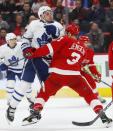 Detroit Red Wings defenseman Nick Jensen (3) defends against Toronto Maple Leafs center Auston Matthews (34) during the first period of an NHL hockey game Thursday, Oct. 11, 2018, in Detroit. (AP Photo/Paul Sancya)